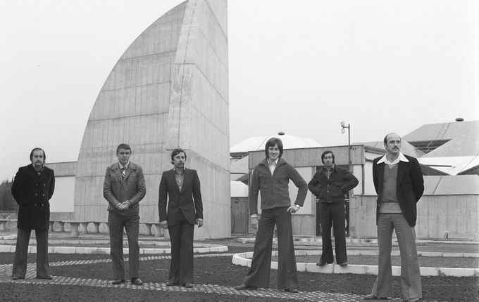 . The Nova Gorica music group Lapos in front of the 15-metre concrete sundial, removed in 1999 due to the construction of a new hall in the Perla casino. &copy;Photo Pavšič, kept by the Goriški muzej Kromberk - Nova Gorica.